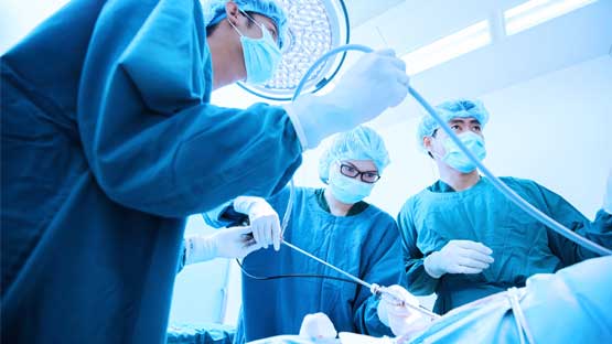 Doctors performing medical endoscopy procedure